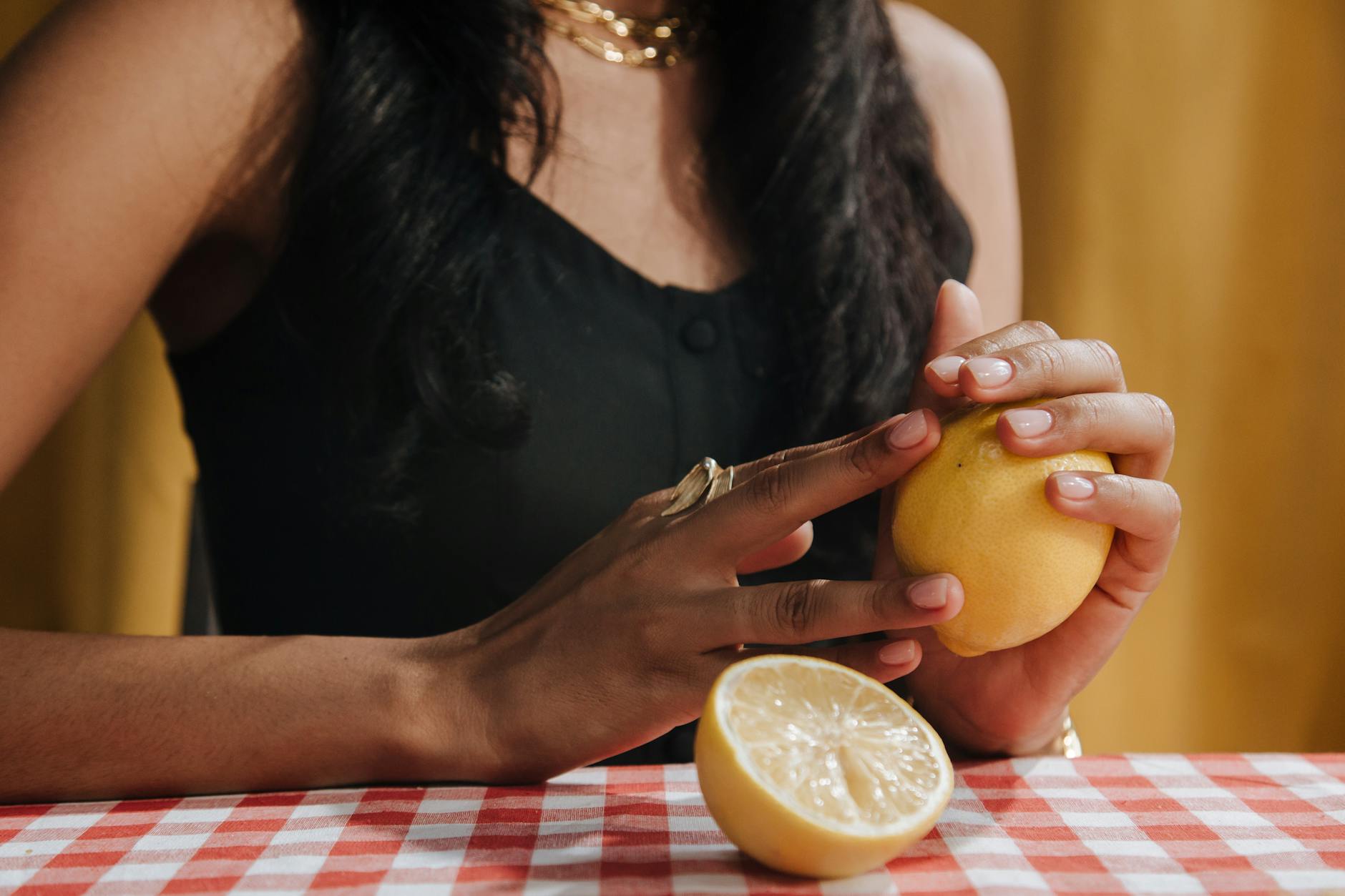 Woman holding two silicone vibrators in a contemplative moment of self-discovery