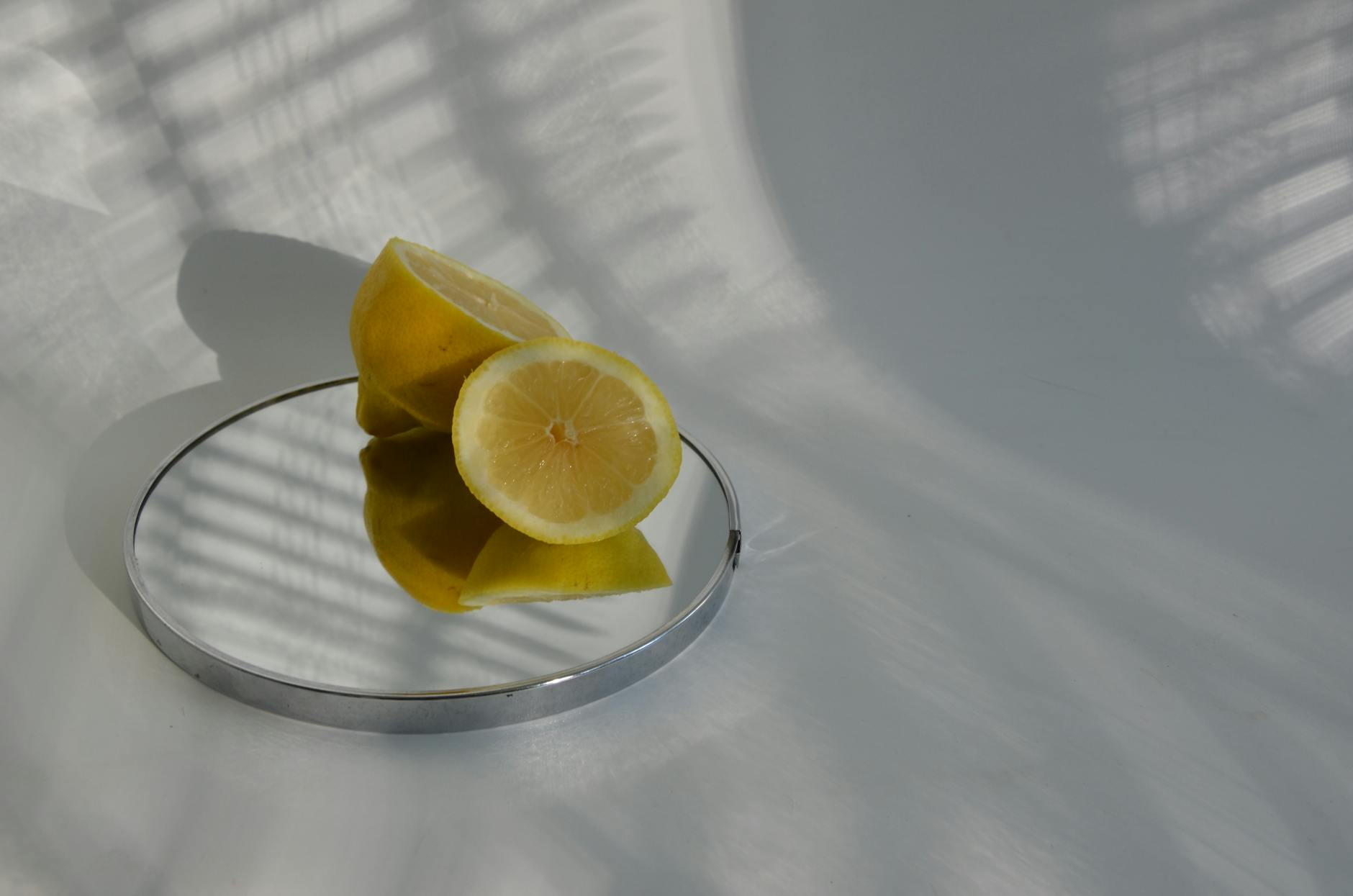 Hands holding a lemon clitoral vibrator against a purple background, symbolizing gentle reconnection with pleasure